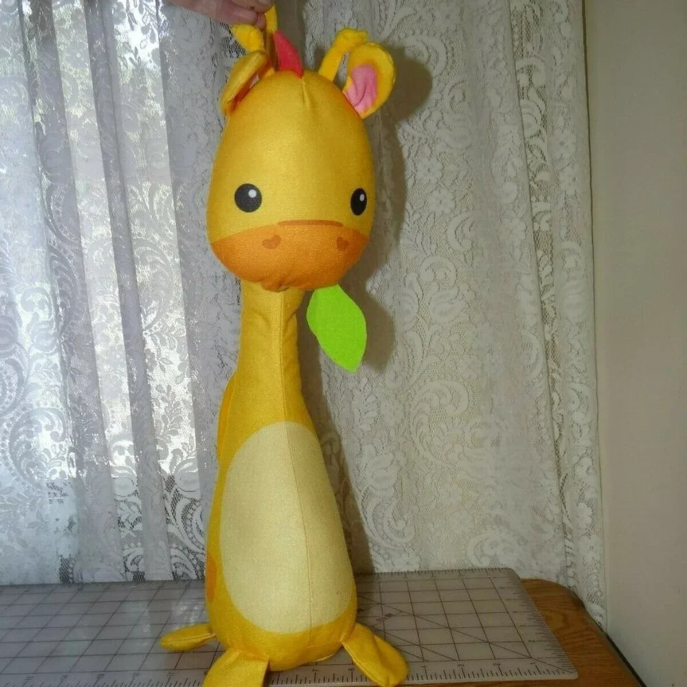 Fisher Price Giraffe ties to crib